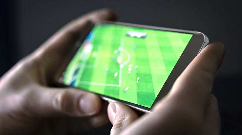 Unlicensed free sports streaming website with its video player covered by intrusive betting advertisements and suspicious pop-up windows.